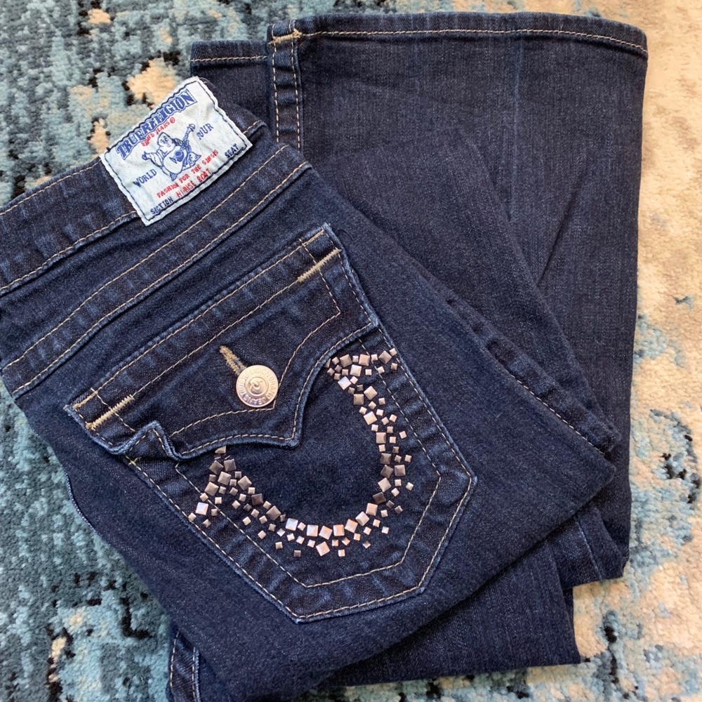 Size 29 dark wash True Religion jeans.
